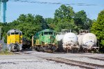 SQVR 3002 and CFWR 106 pose next to some stored tank cars